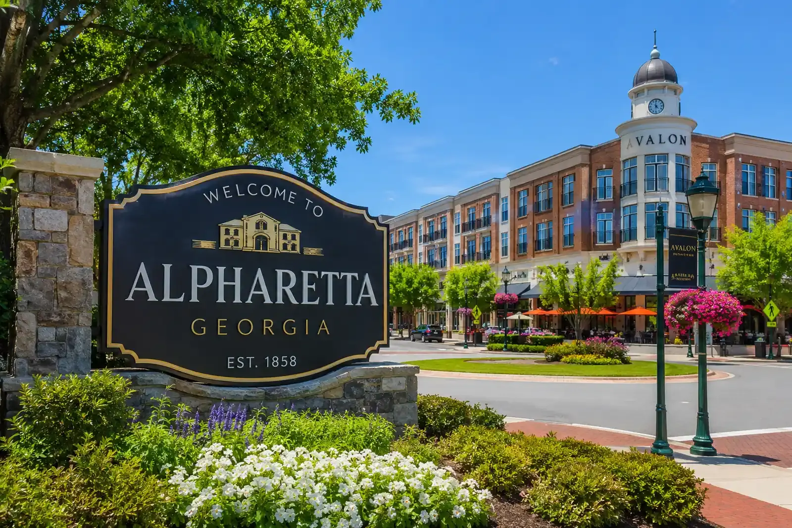 Downtown streetscape with landscaped sidewalks and mixed-use buildings in Alpharetta, Georgia.