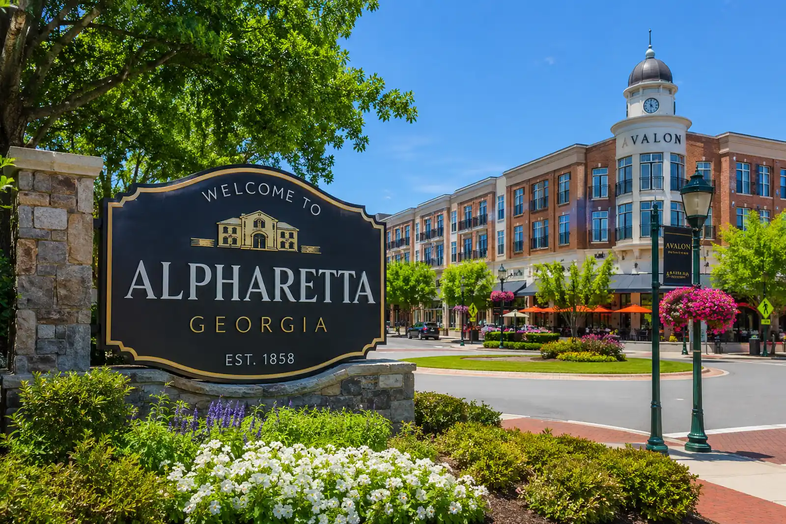 Downtown streetscape with landscaped sidewalks and mixed-use buildings in Alpharetta, Georgia.