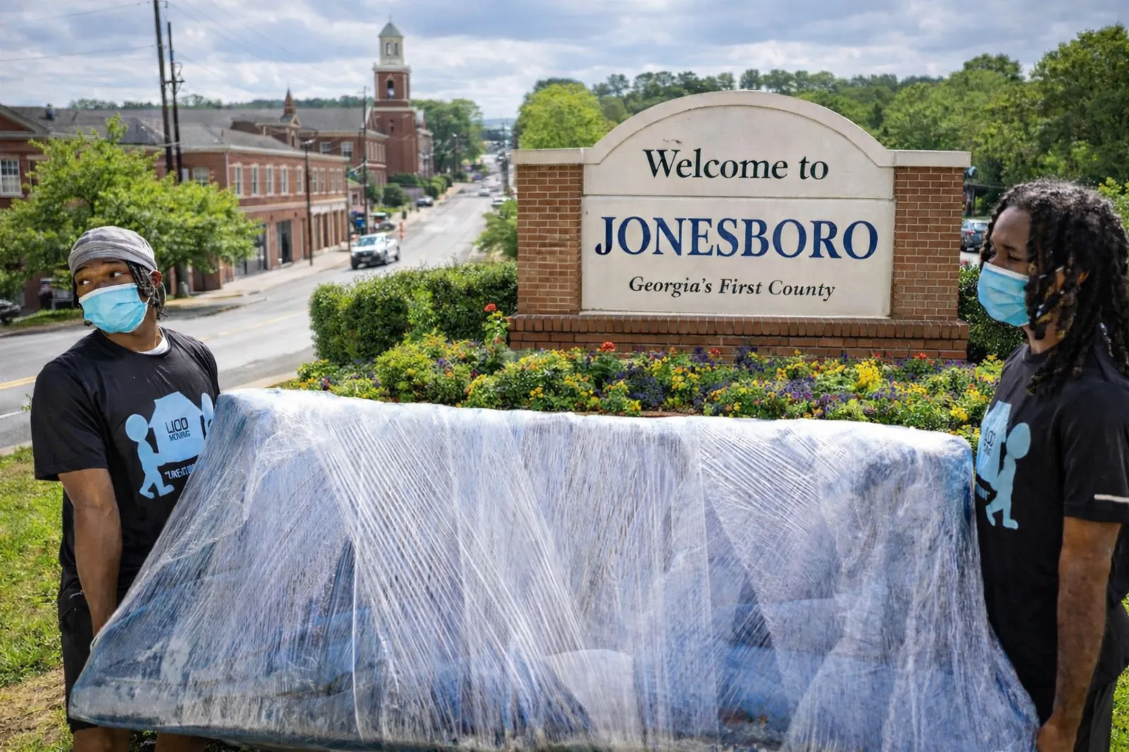 Local Jonesboro movers from LIOO Moving wrapping and transporting furniture near downtown Jonesboro, Georgia