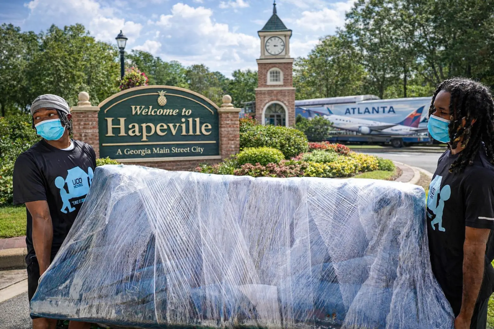 LIOO Moving crew wrapping furniture for a residential move in Hapeville, Georgia near Atlanta Airport